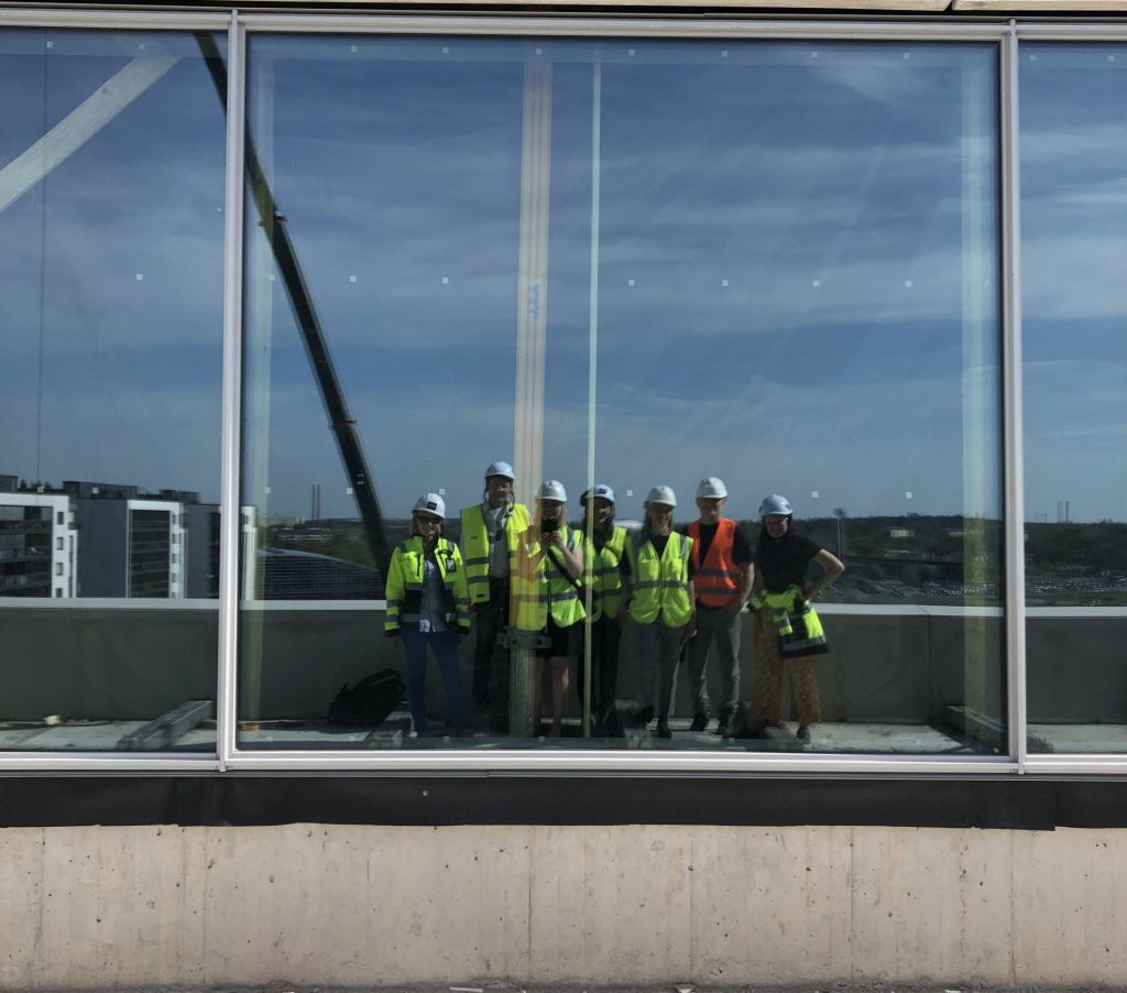 team of artists visiting the site